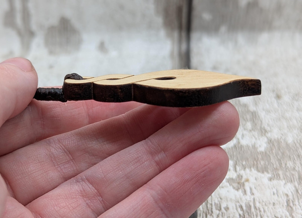 Lime wood, laser printed and cut pikorua pendant.