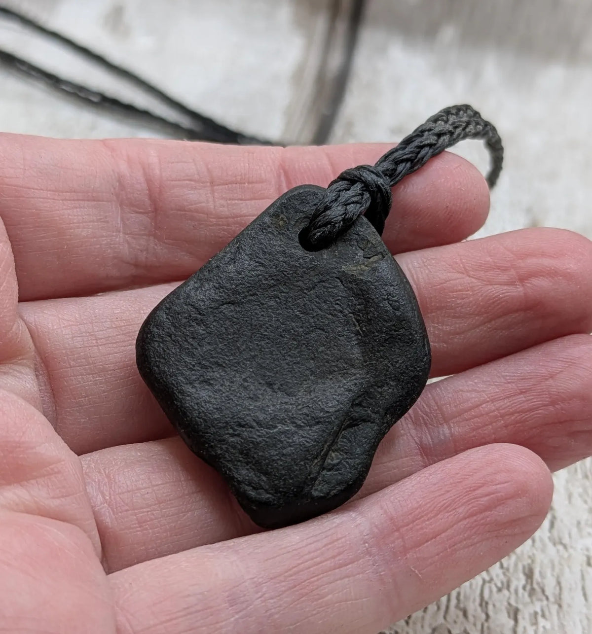 Naturally tumbled Whitby jet pendant.