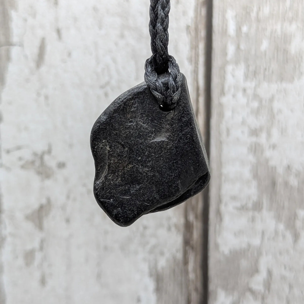 Naturally tumbled Whitby jet pendant.