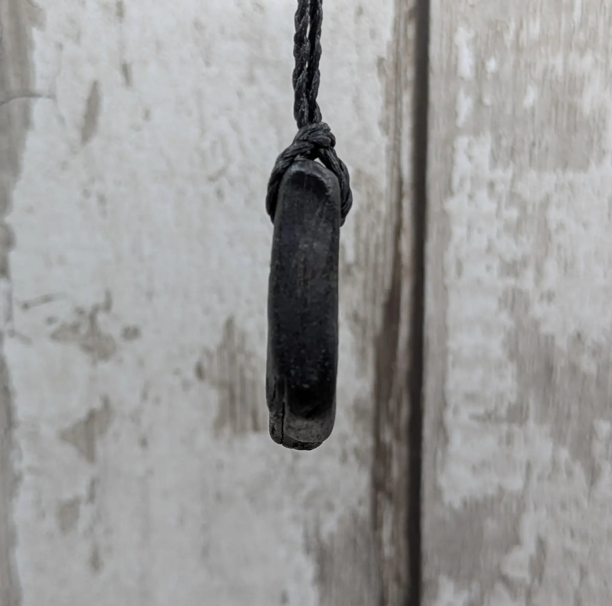 Naturally tumbled Whitby jet pendant.