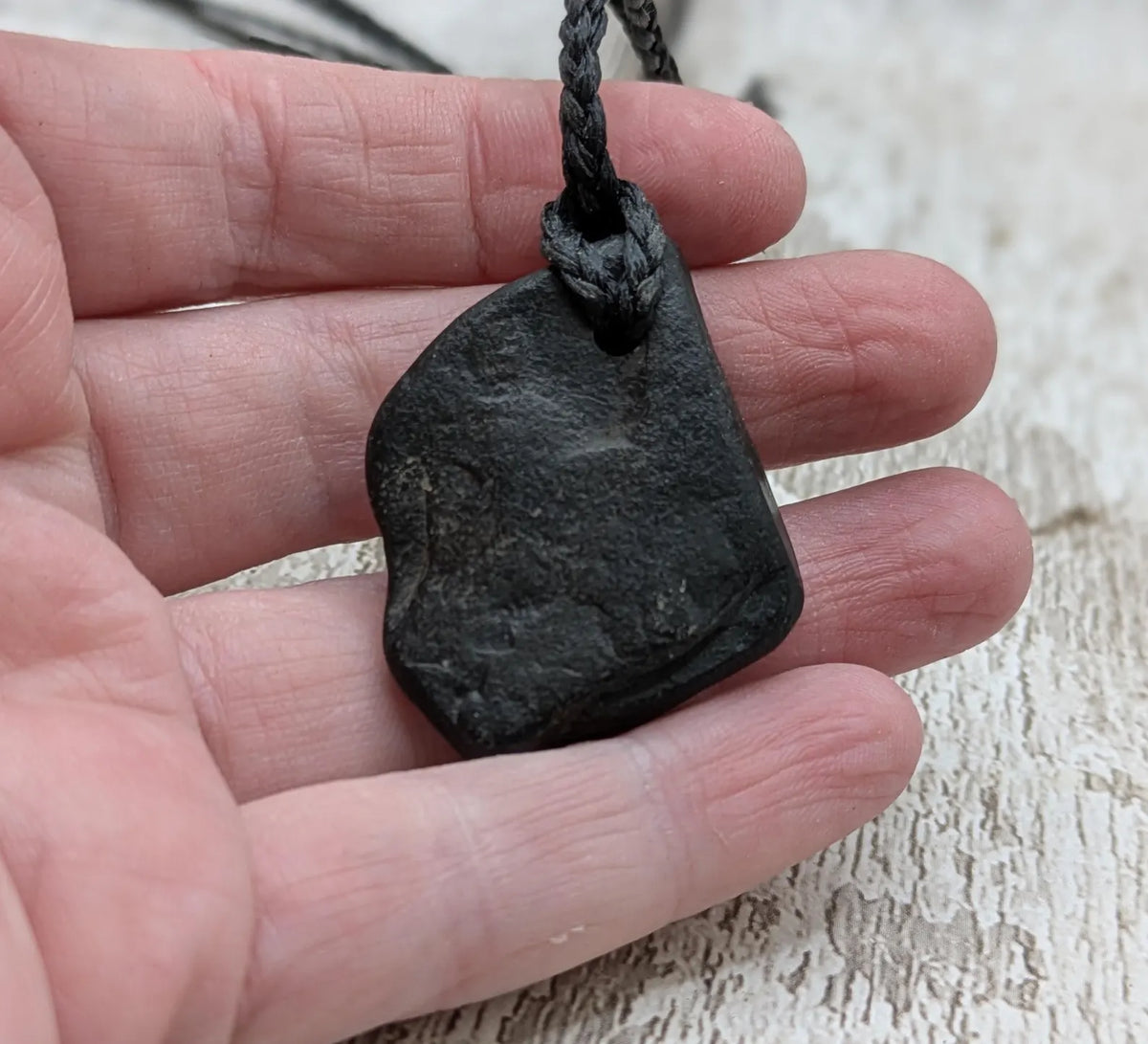 Naturally tumbled Whitby jet pendant.