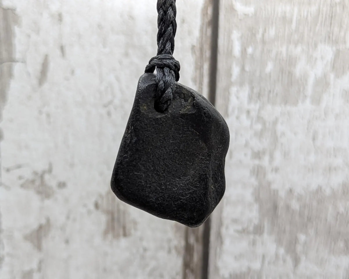 Naturally tumbled Whitby jet pendant.