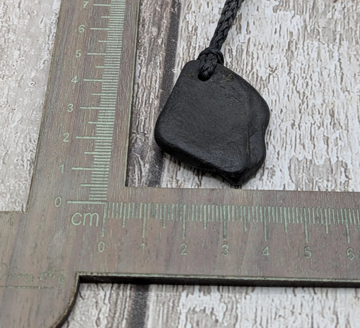 Naturally tumbled Whitby jet pendant.