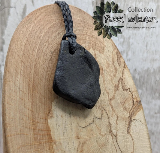 Naturally tumbled Whitby jet pendant.