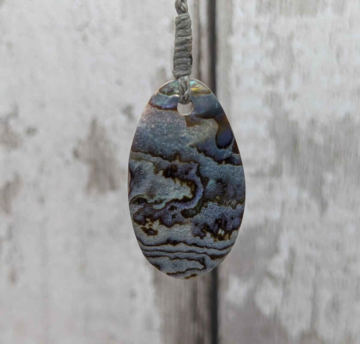 New Zealand rainbow paua abalone shell tumbled offcut unisex pendant.