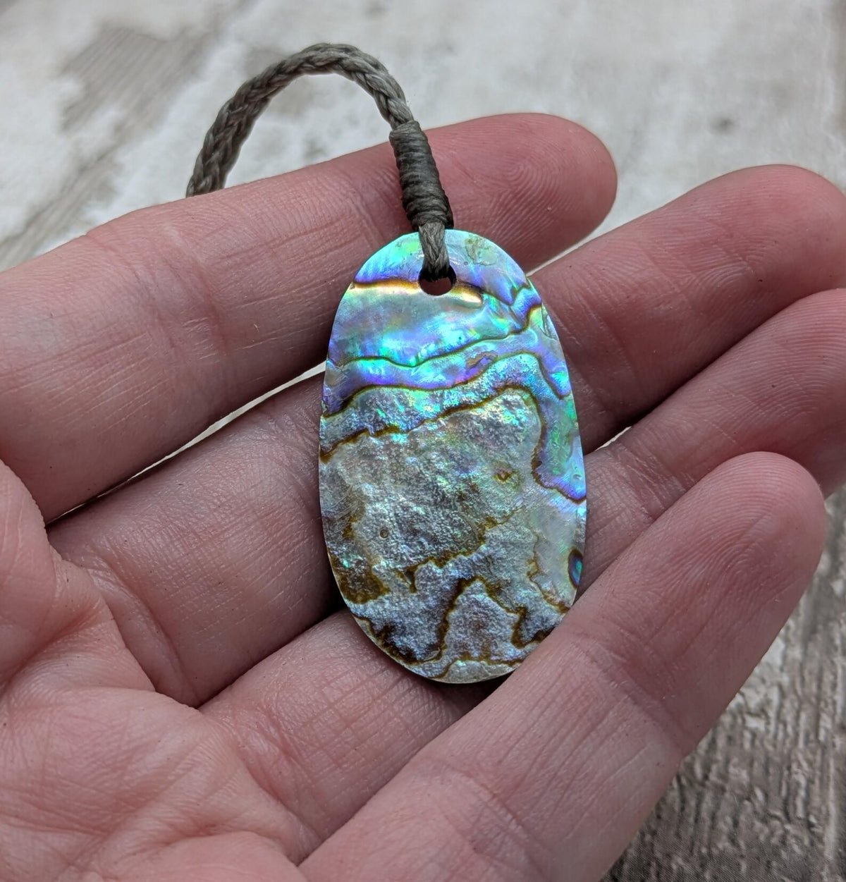 New Zealand rainbow paua abalone shell tumbled offcut unisex pendant.