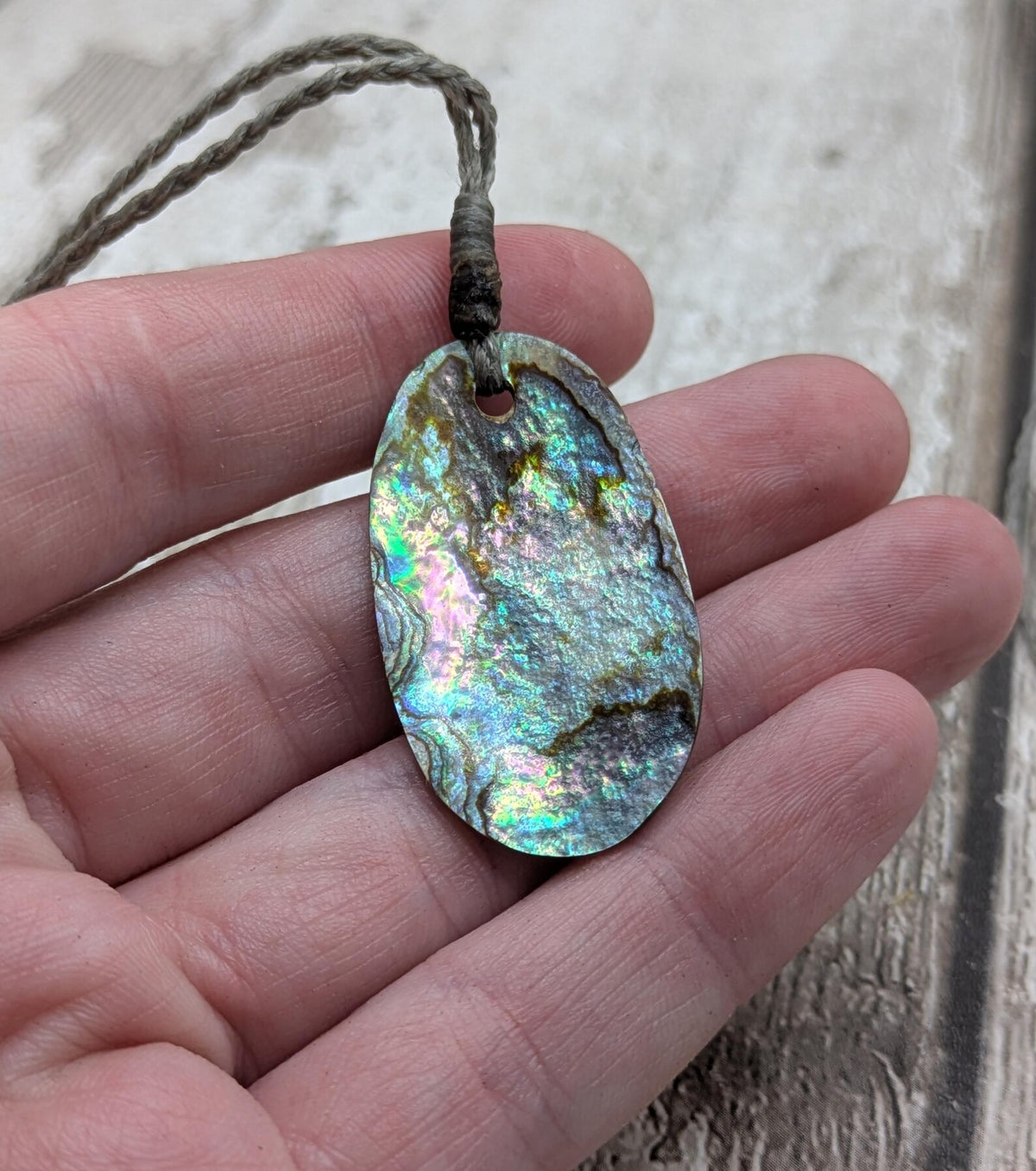 New Zealand rainbow paua abalone shell tumbled offcut unisex pendant.