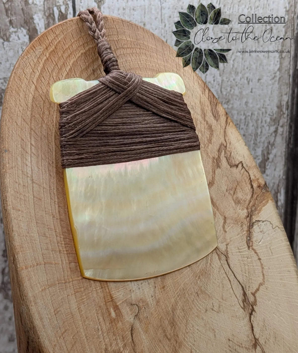 Mother of pearl hei toki adze pendant.