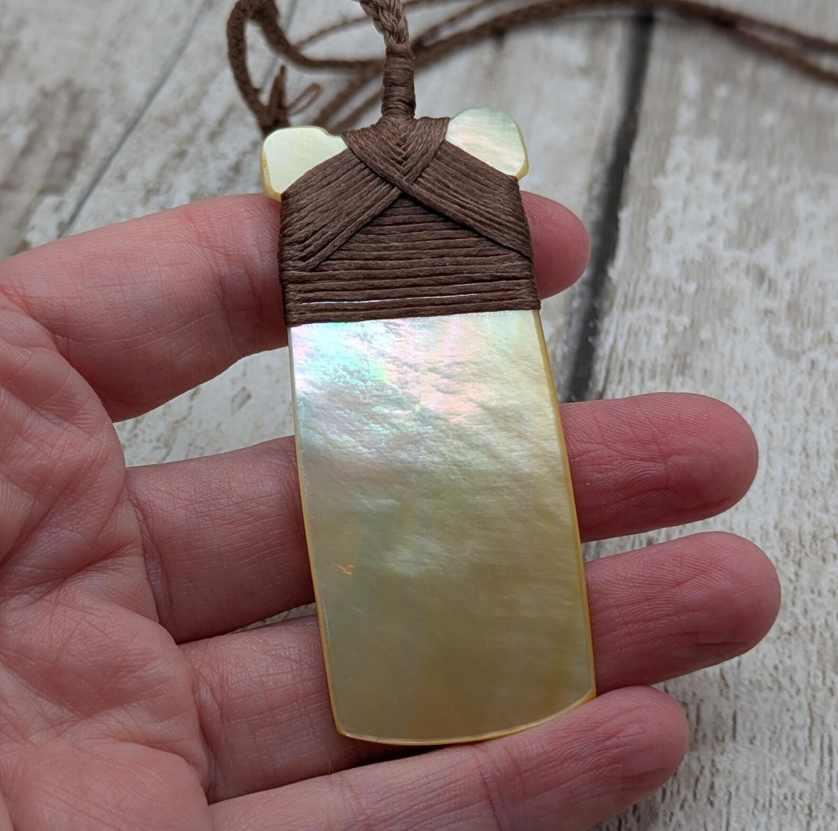 Mother of pearl hei toki adze pendant.