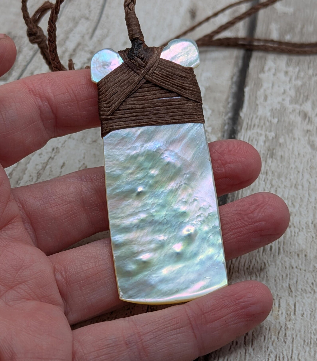 Mother of pearl hei toki adze pendant.