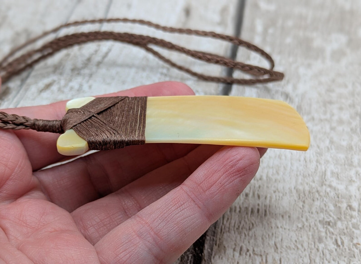 Mother of pearl hei toki adze pendant.