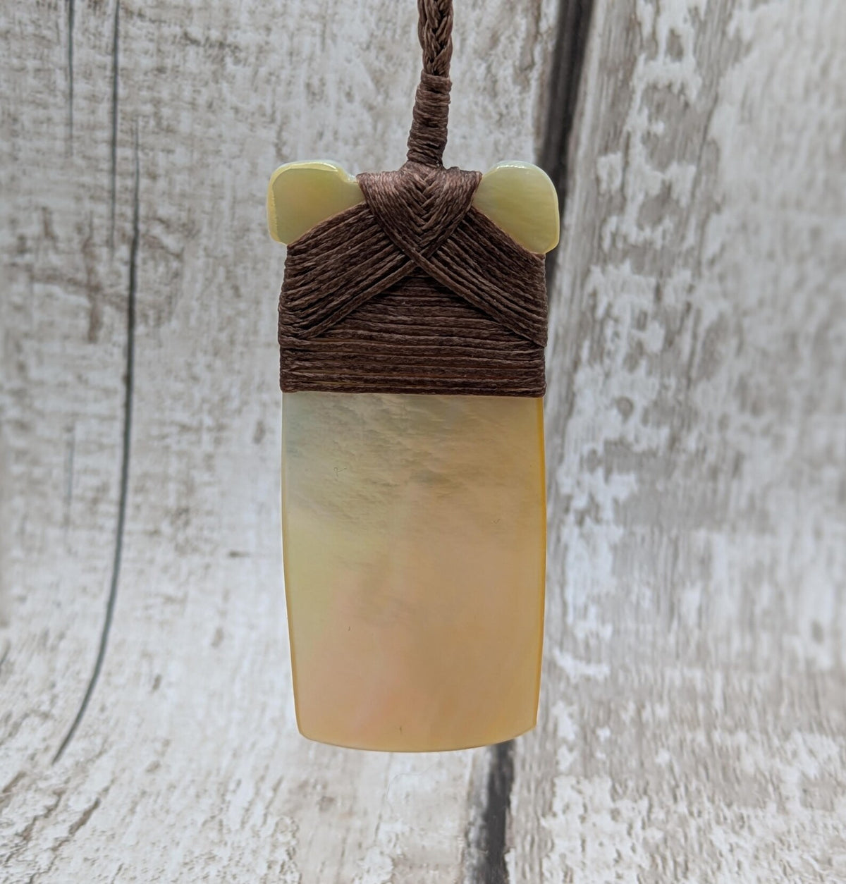 Mother of pearl hei toki adze pendant.
