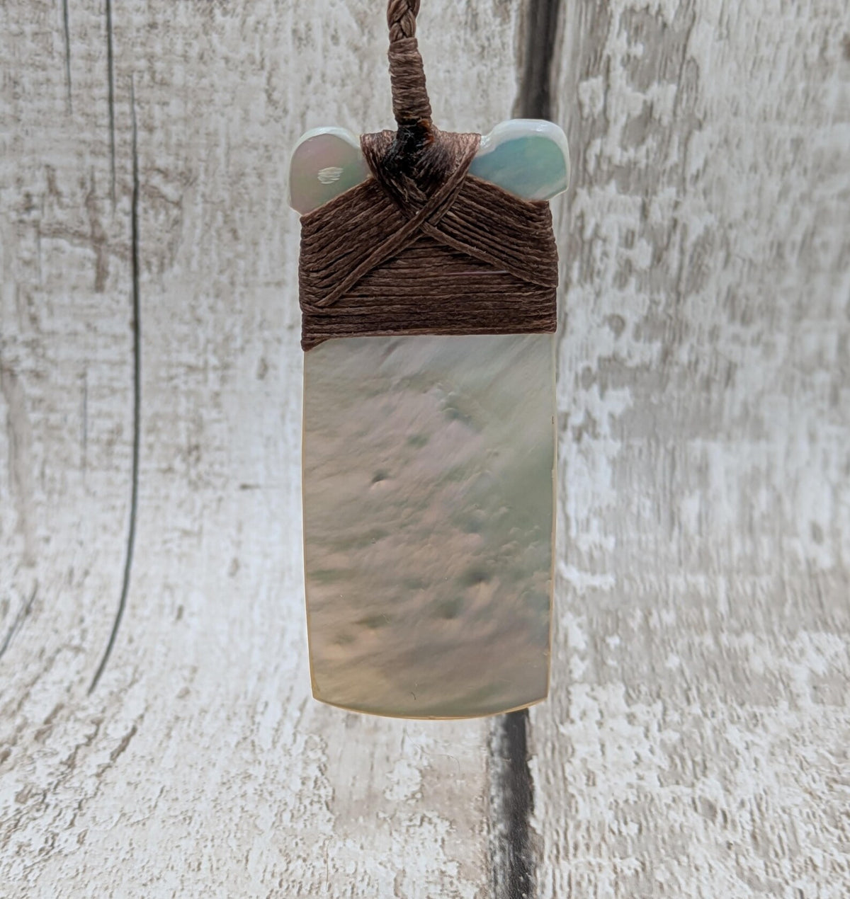 Mother of pearl hei toki adze pendant.