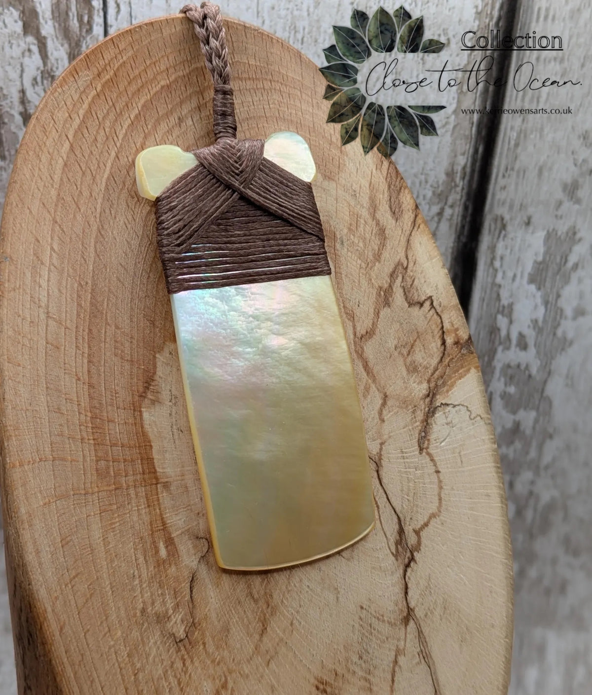 Mother of pearl hei toki adze pendant.