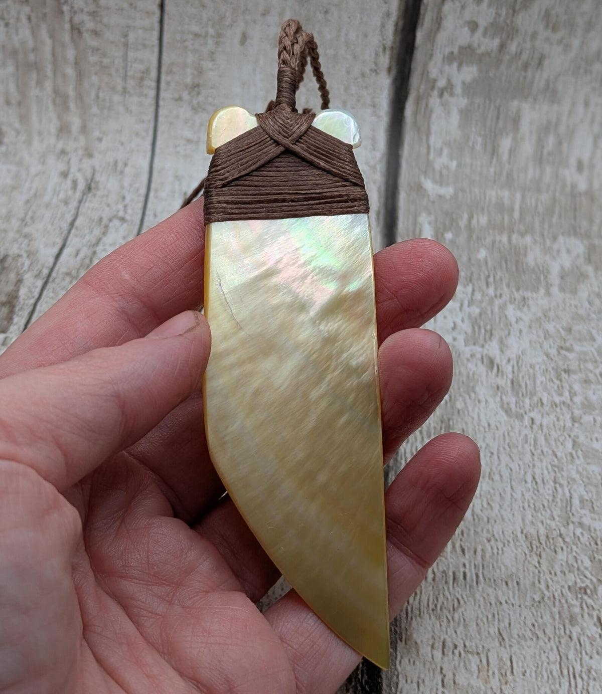 Mother of pearl hei toki adze pendant.