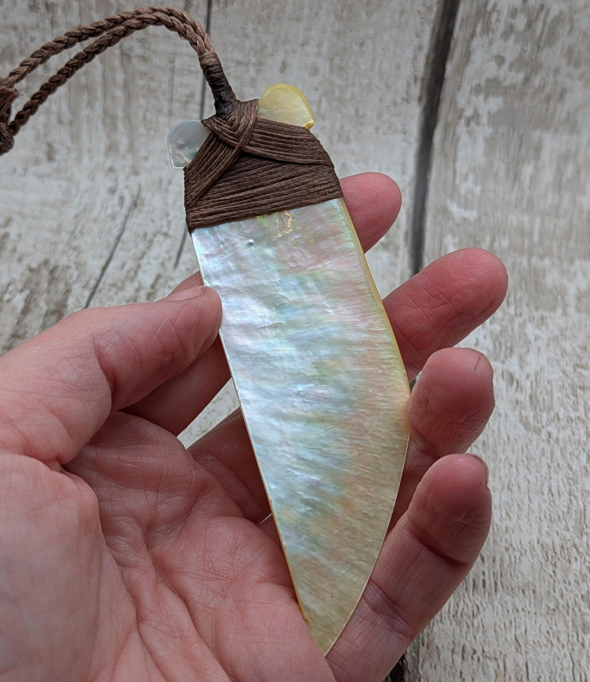 Mother of pearl hei toki adze pendant.