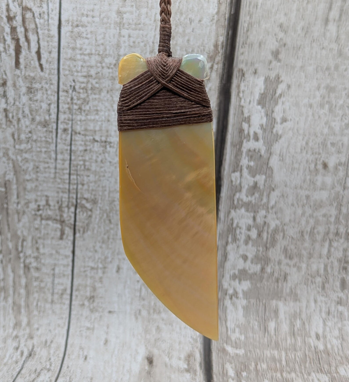 Mother of pearl hei toki adze pendant.