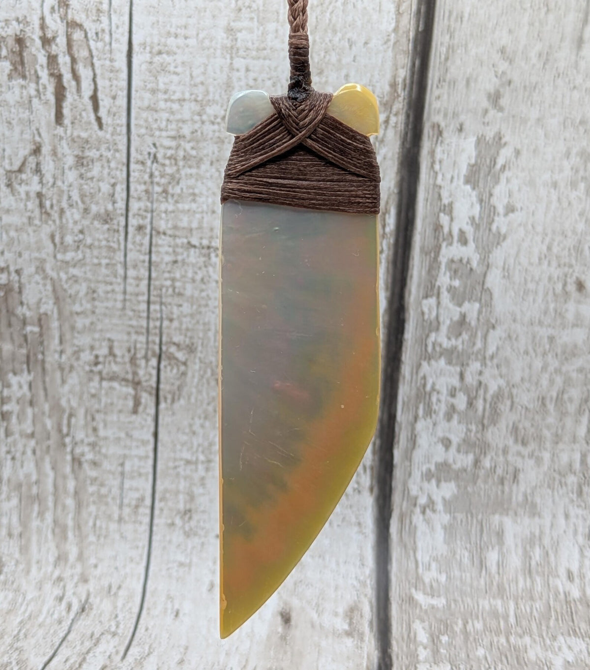 Mother of pearl hei toki adze pendant.
