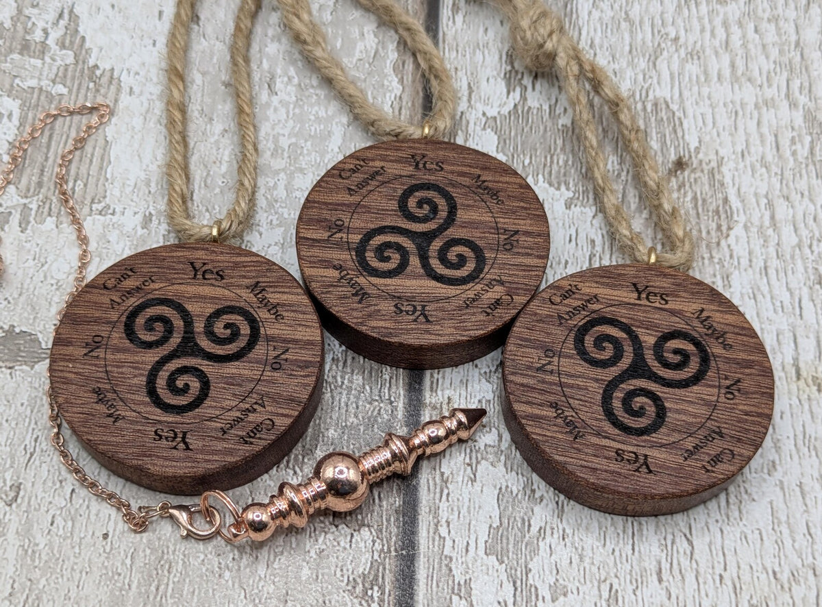 Sepele mahogany mini pocket sized pendulum boards with triskele design.