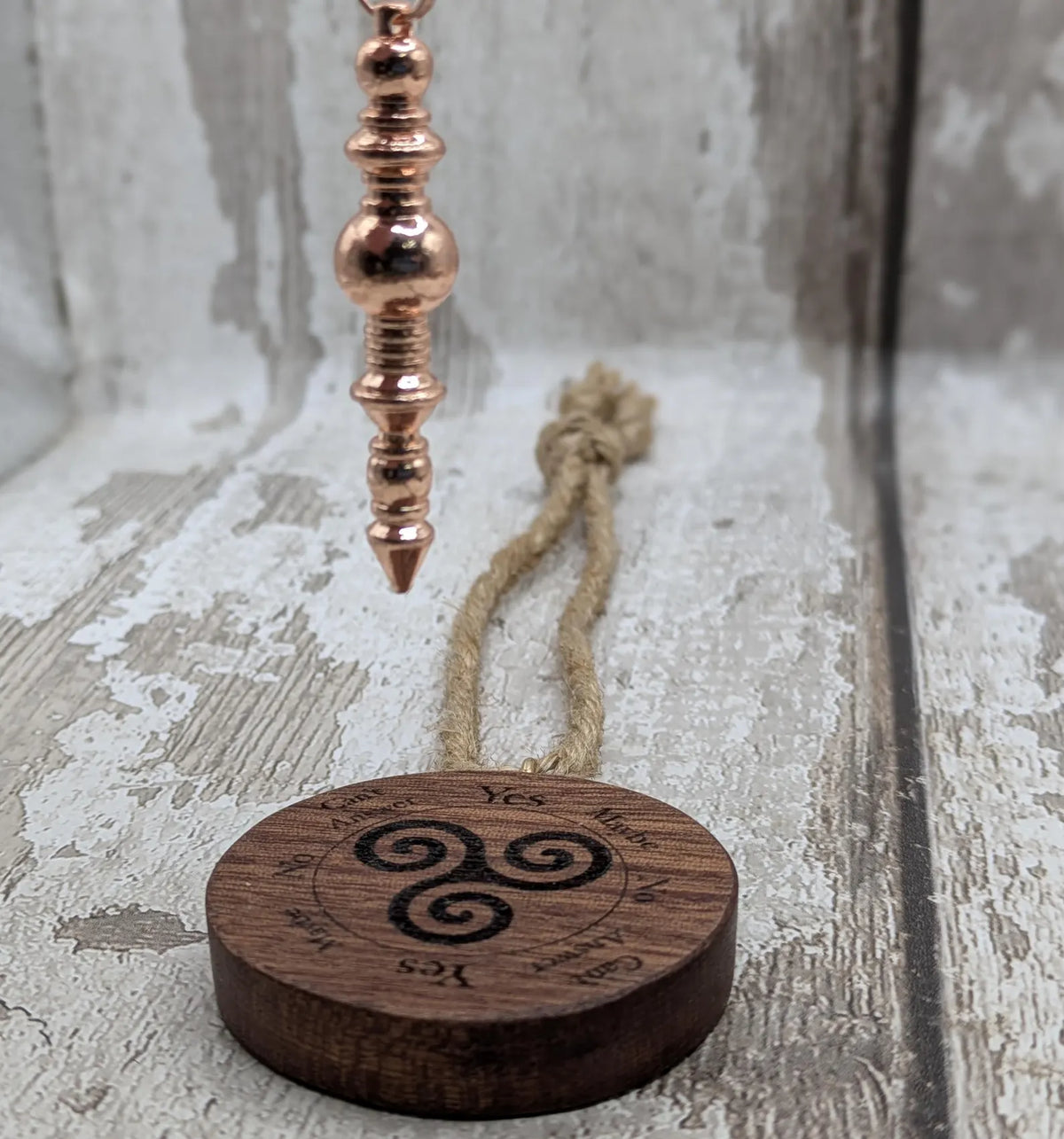 Sepele mahogany mini pocket sized pendulum boards with triskele design.
