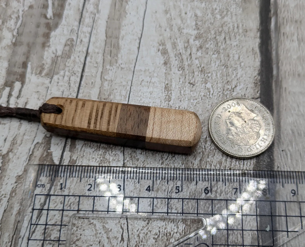 mixed wood roimata teardrop pendant.