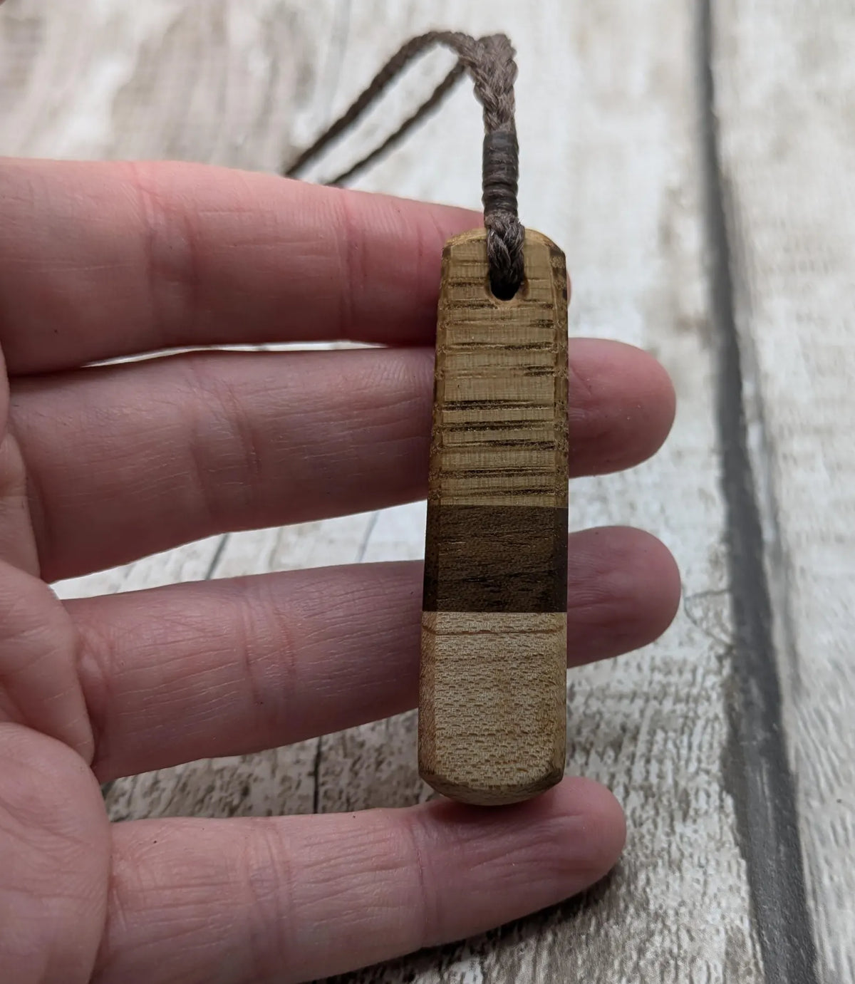 mixed wood roimata teardrop pendant.