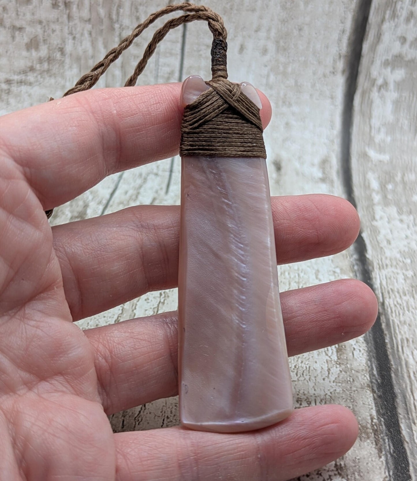 New Zealand freshwater pink mussel shell Hei Toki adze pendant.