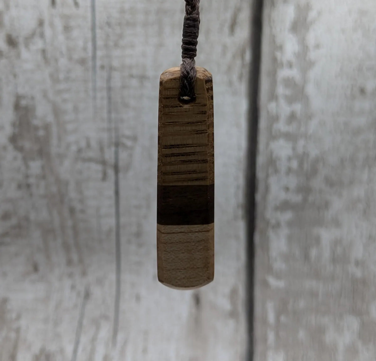 mixed wood roimata teardrop pendant.