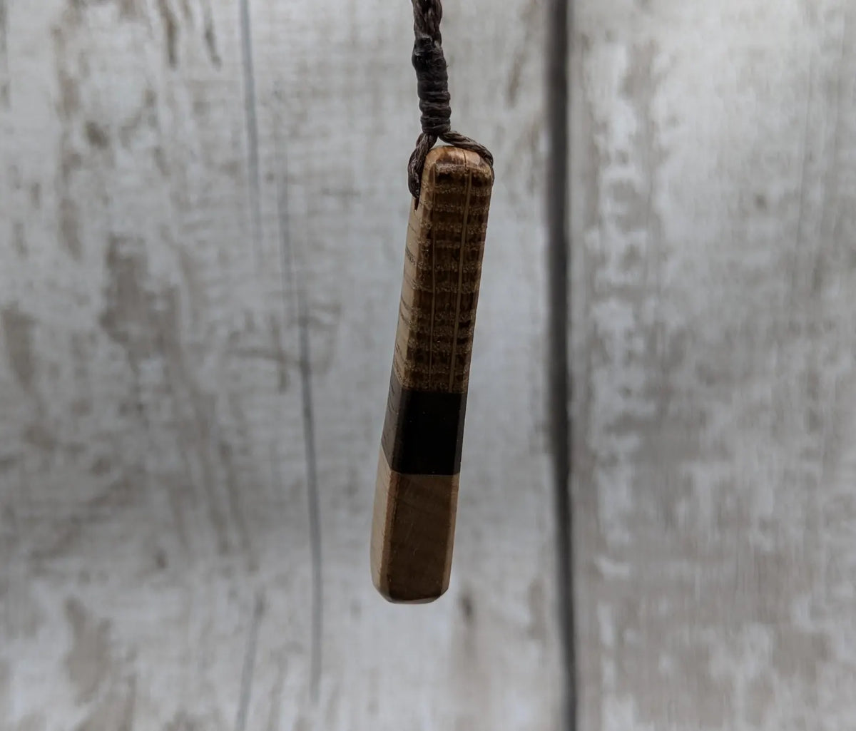 mixed wood roimata teardrop pendant.