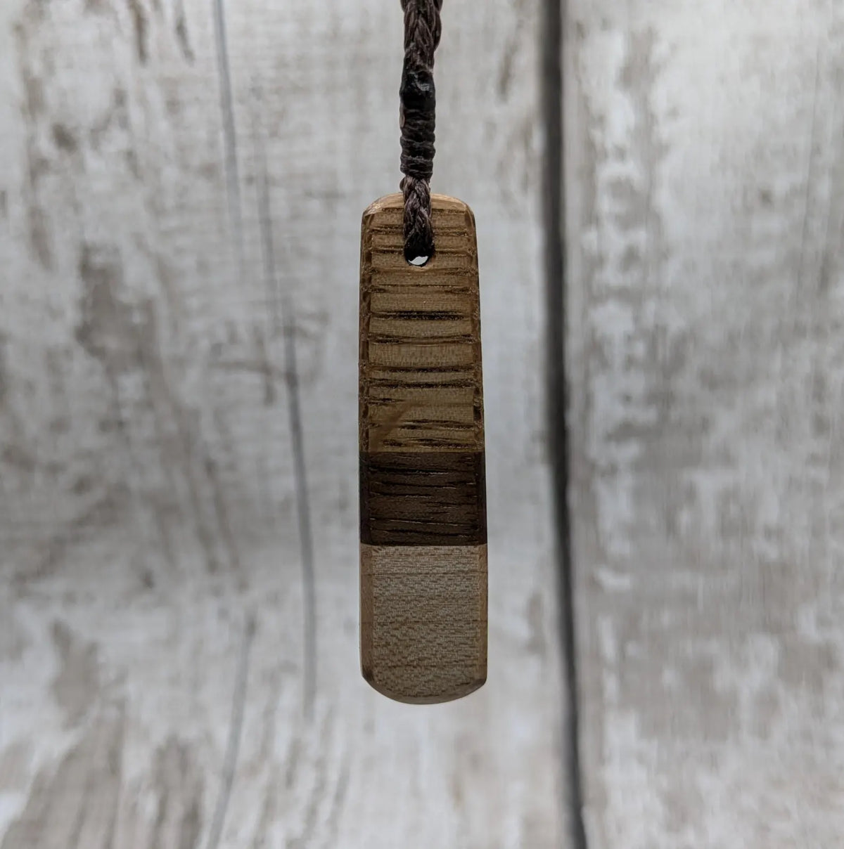 mixed wood roimata teardrop pendant.