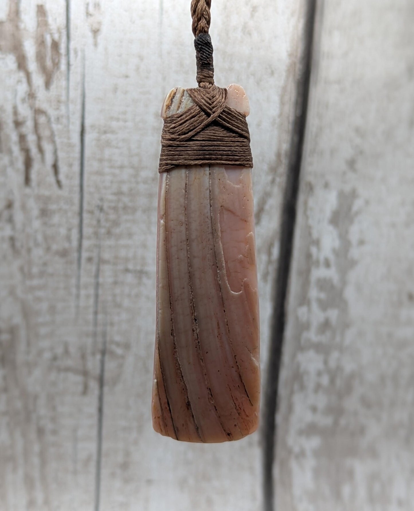 New Zealand freshwater pink mussel shell Hei Toki adze pendant.