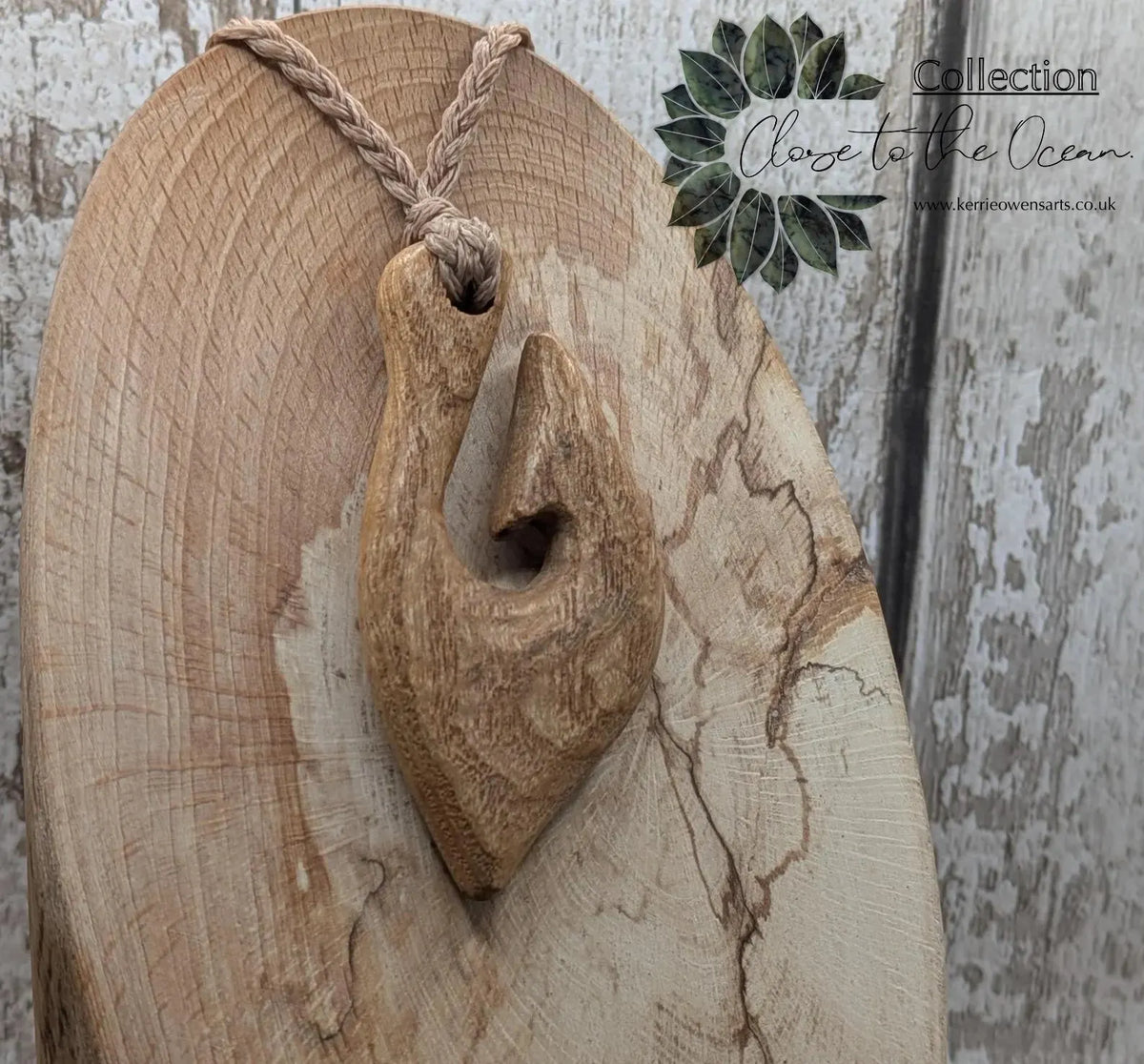 Ash wood hei matau fish hook pendant.
