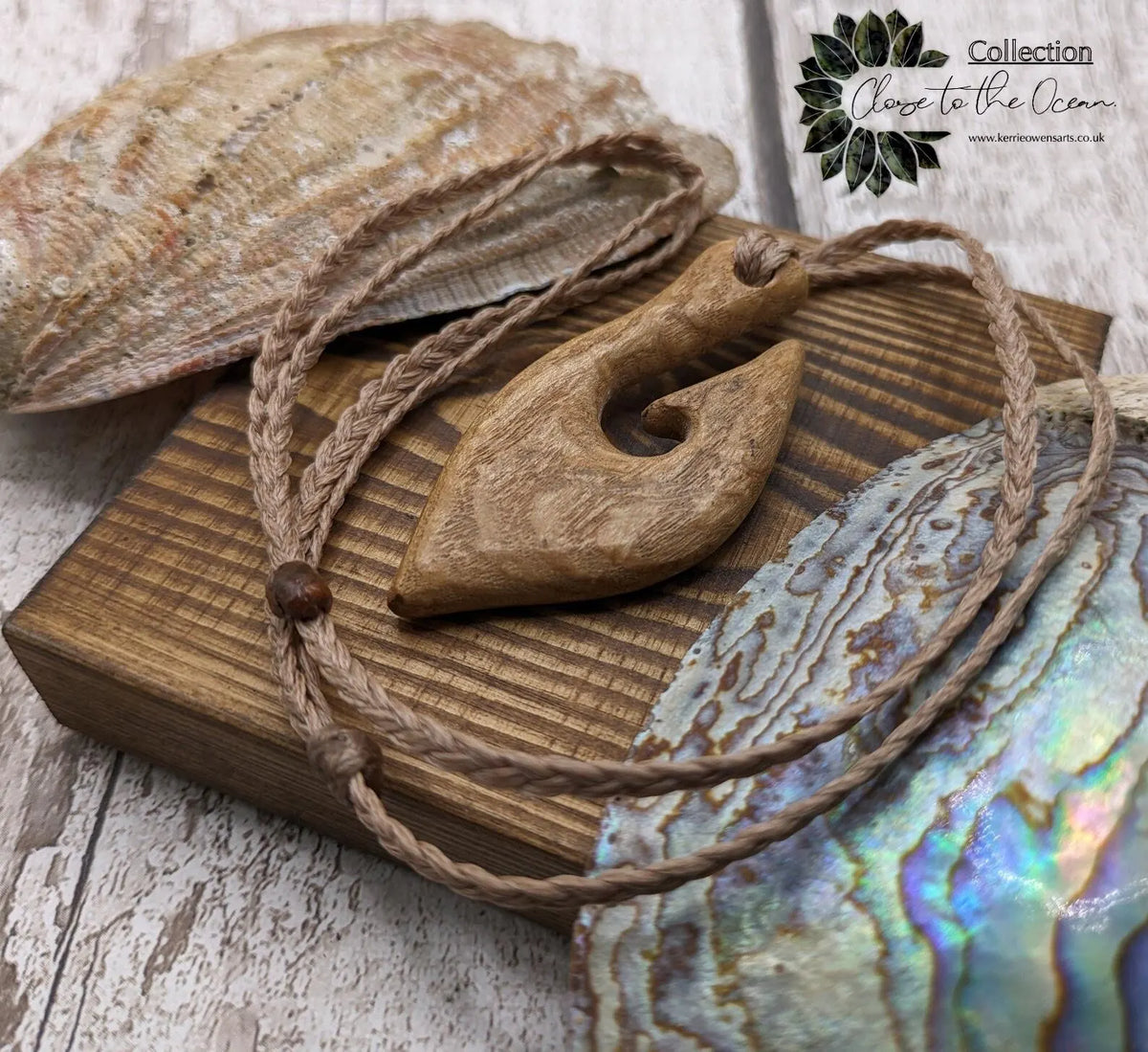 Ash wood hei matau fish hook pendant.