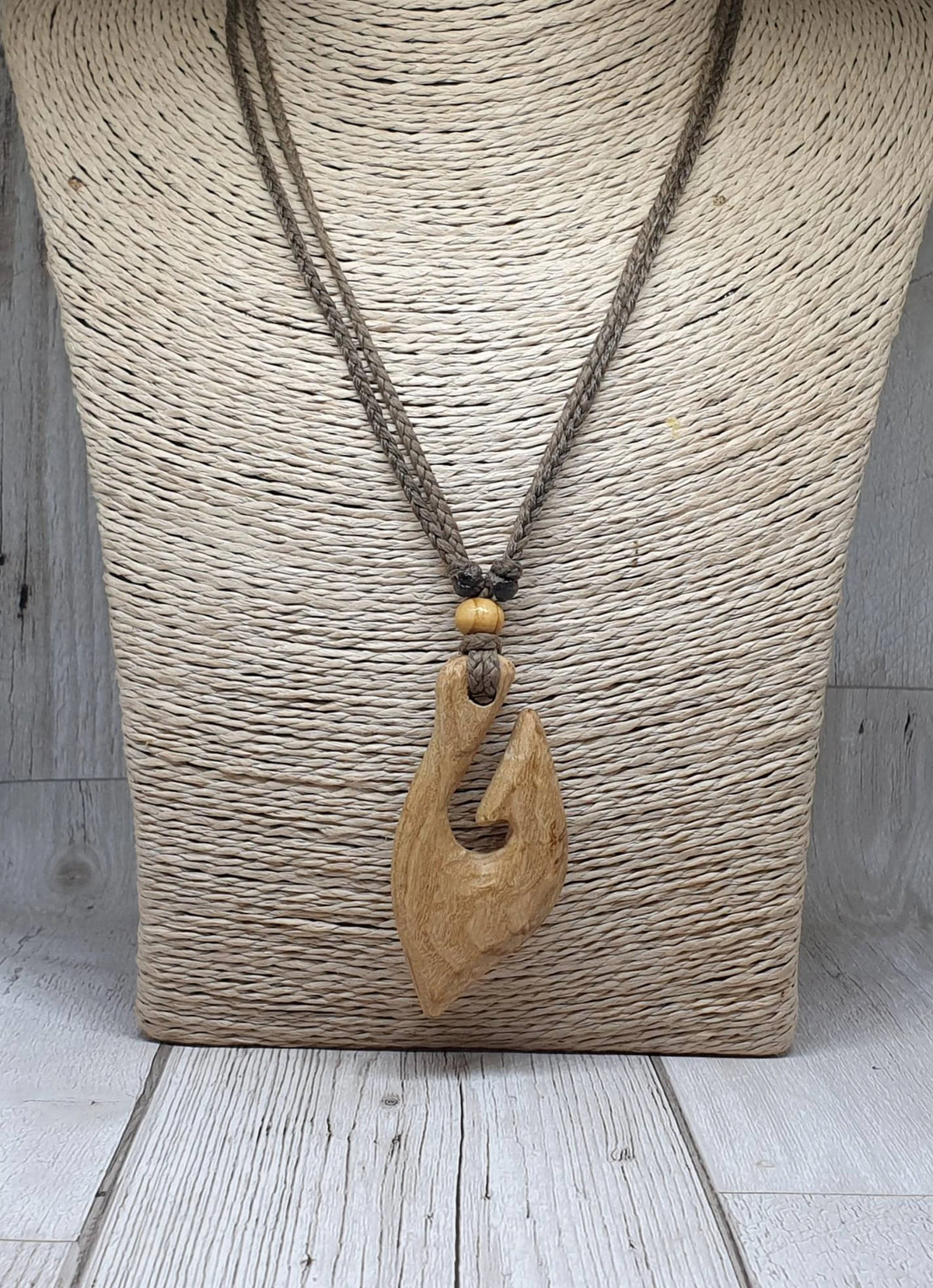 Ash wood hei matau fish hook pendant.