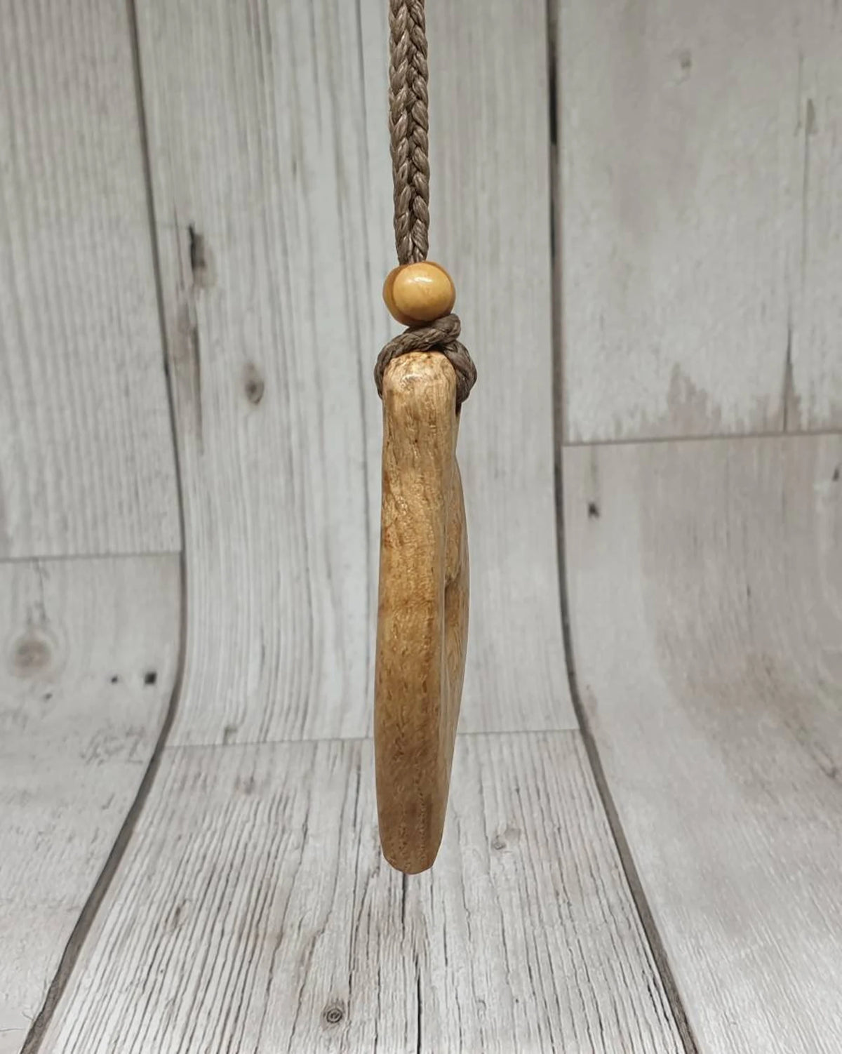 Ash wood hei matau fish hook pendant.