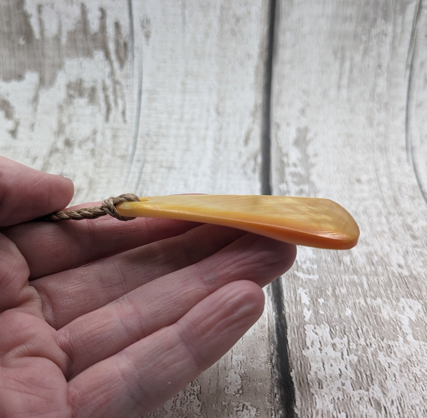 Mother of Pearl triangular pendant.