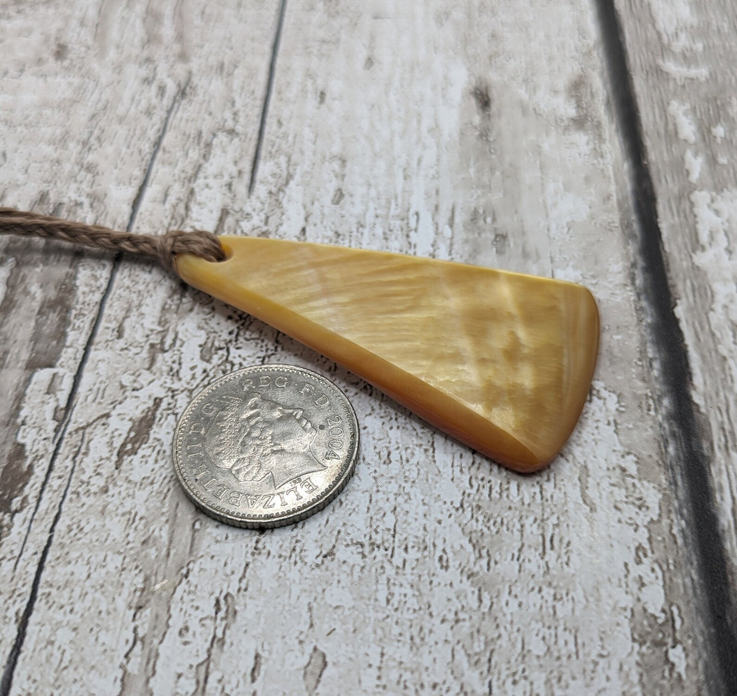 Mother of Pearl triangular pendant.