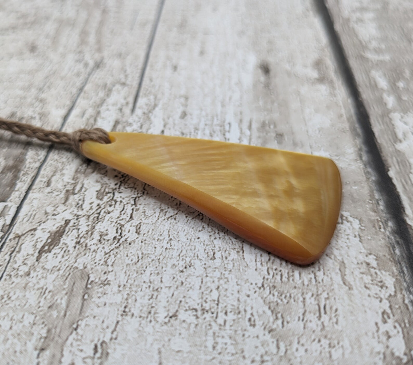 Mother of Pearl triangular pendant.