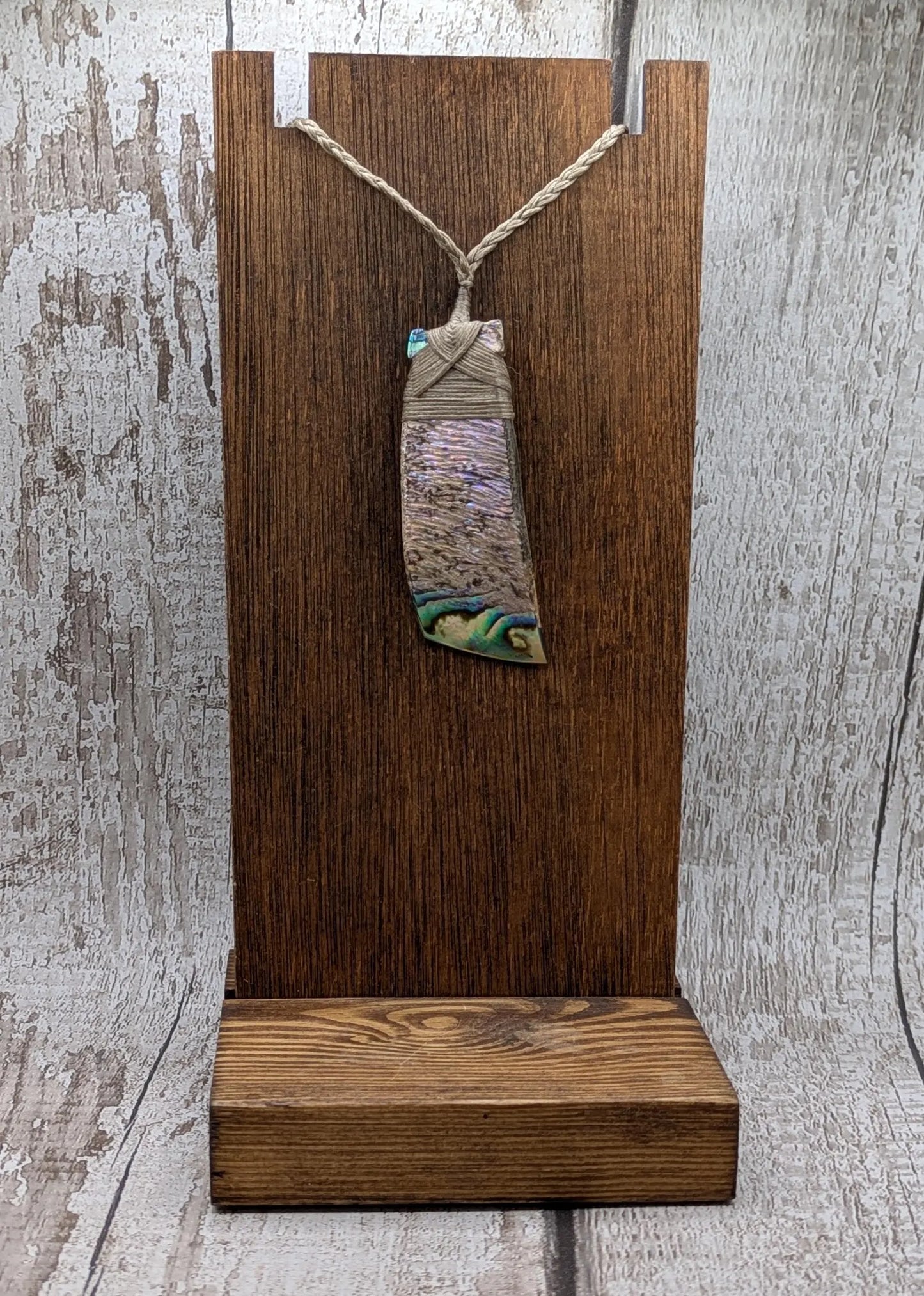 Wild New Zealand rainbow Pāua Hei toki adze pendant.