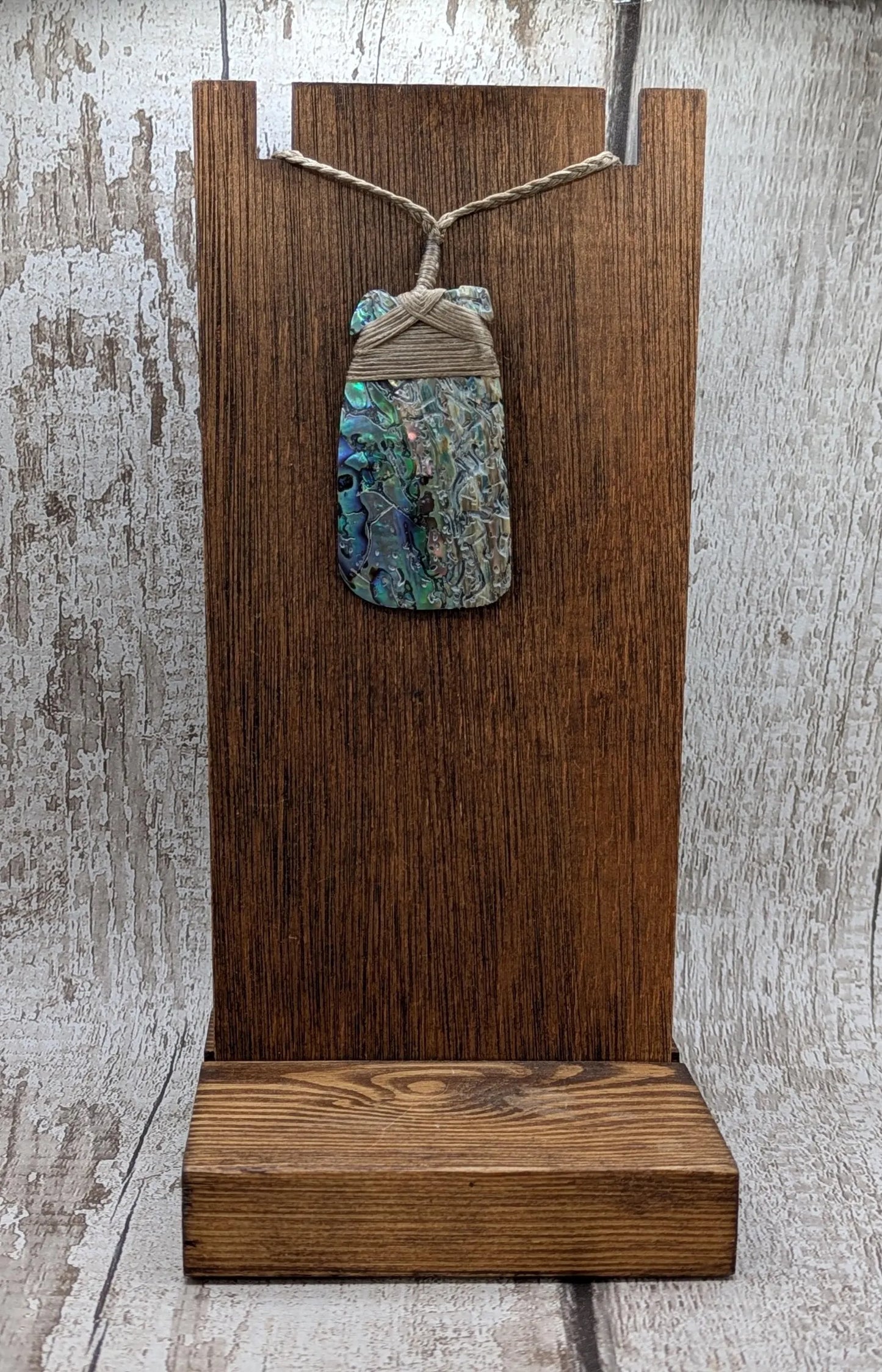Wild New Zealand rainbow Pāua Hei Toki adze pendant.