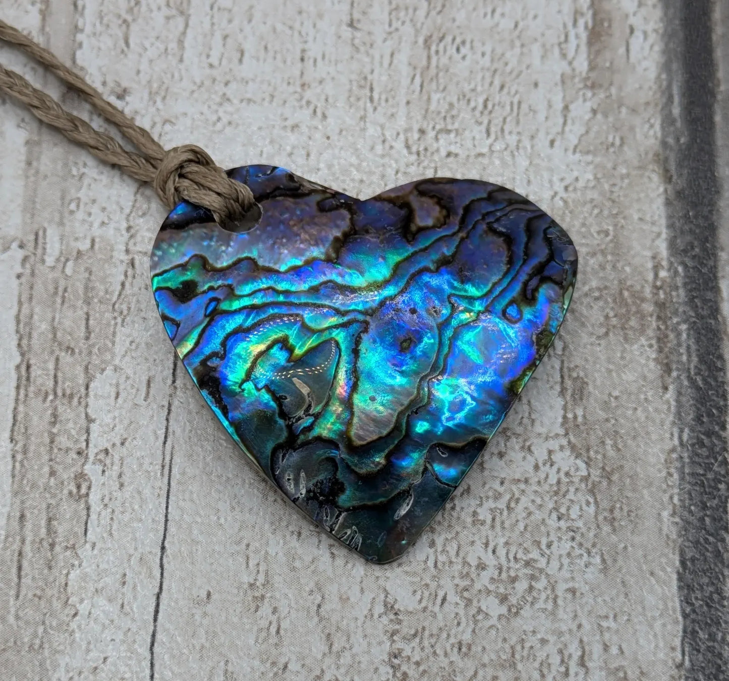 New Zealand wild rainbow Pāua abalone heart pendant.