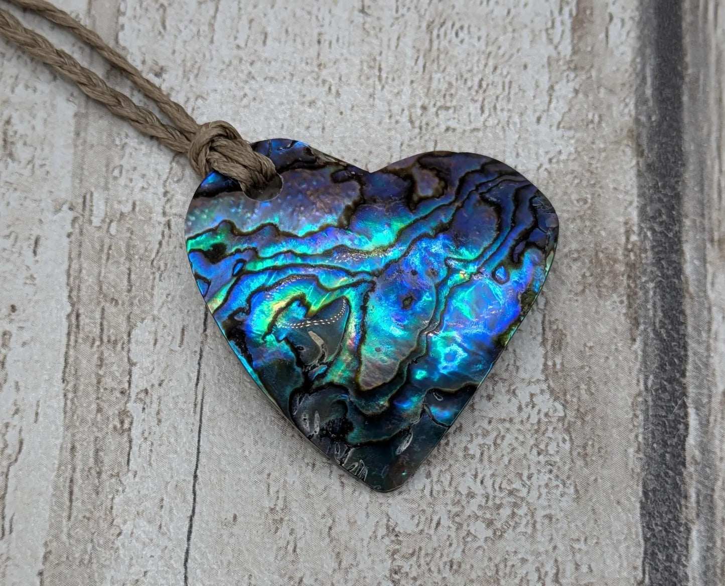 New Zealand wild rainbow Pāua abalone heart pendant.