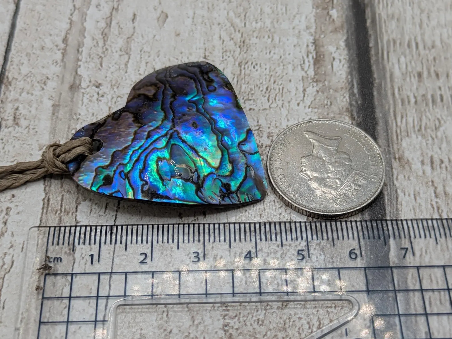 New Zealand wild rainbow Pāua abalone heart pendant.