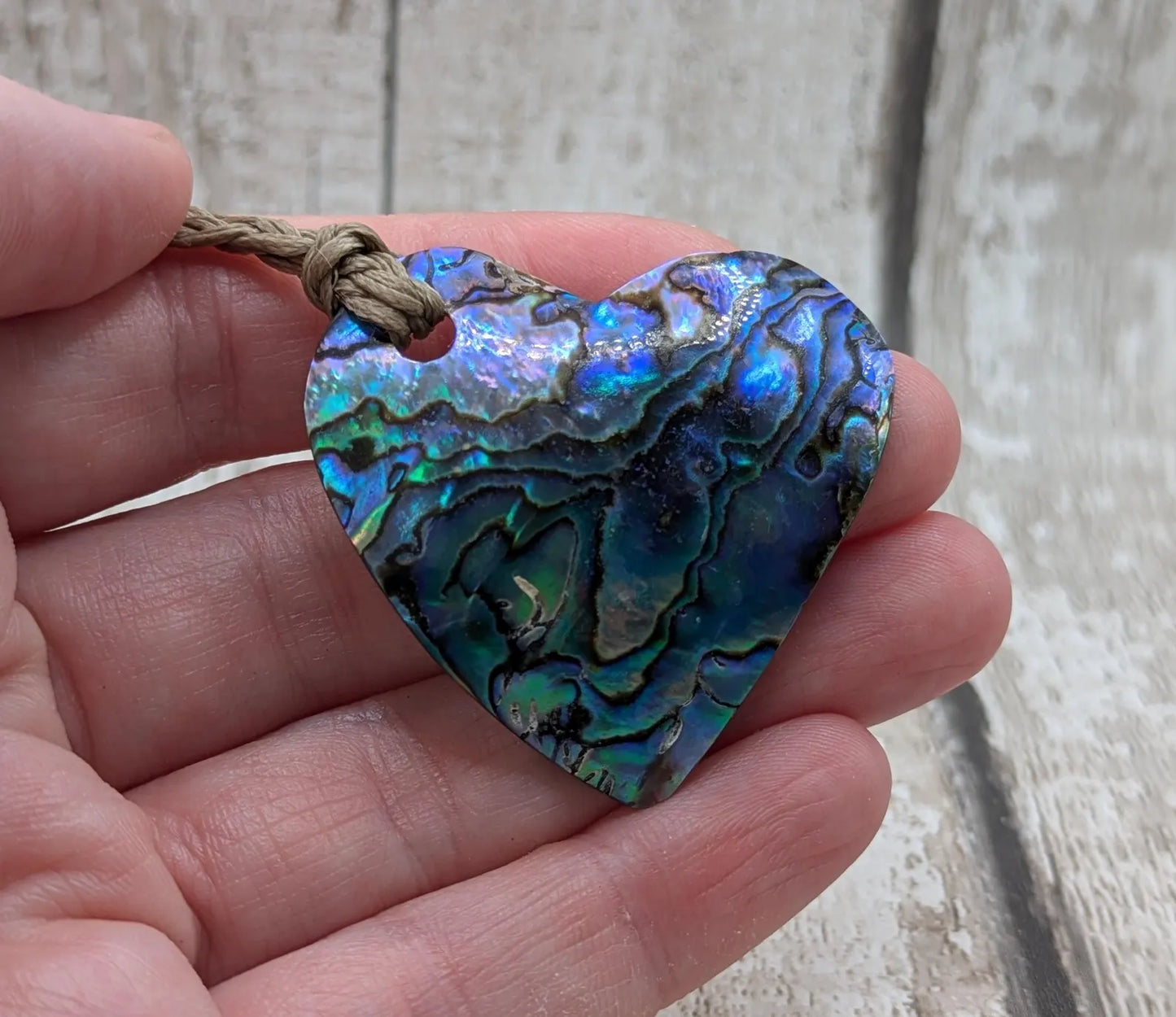 New Zealand wild rainbow Pāua abalone heart pendant.