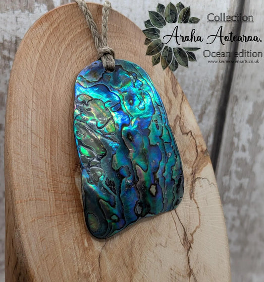 Wild New Zealand beach combed free form rainbow Pāua pendant