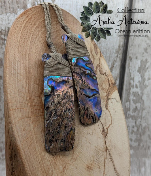 One New Zealand wild rainbow Pāua Hei Toki adze pendant.