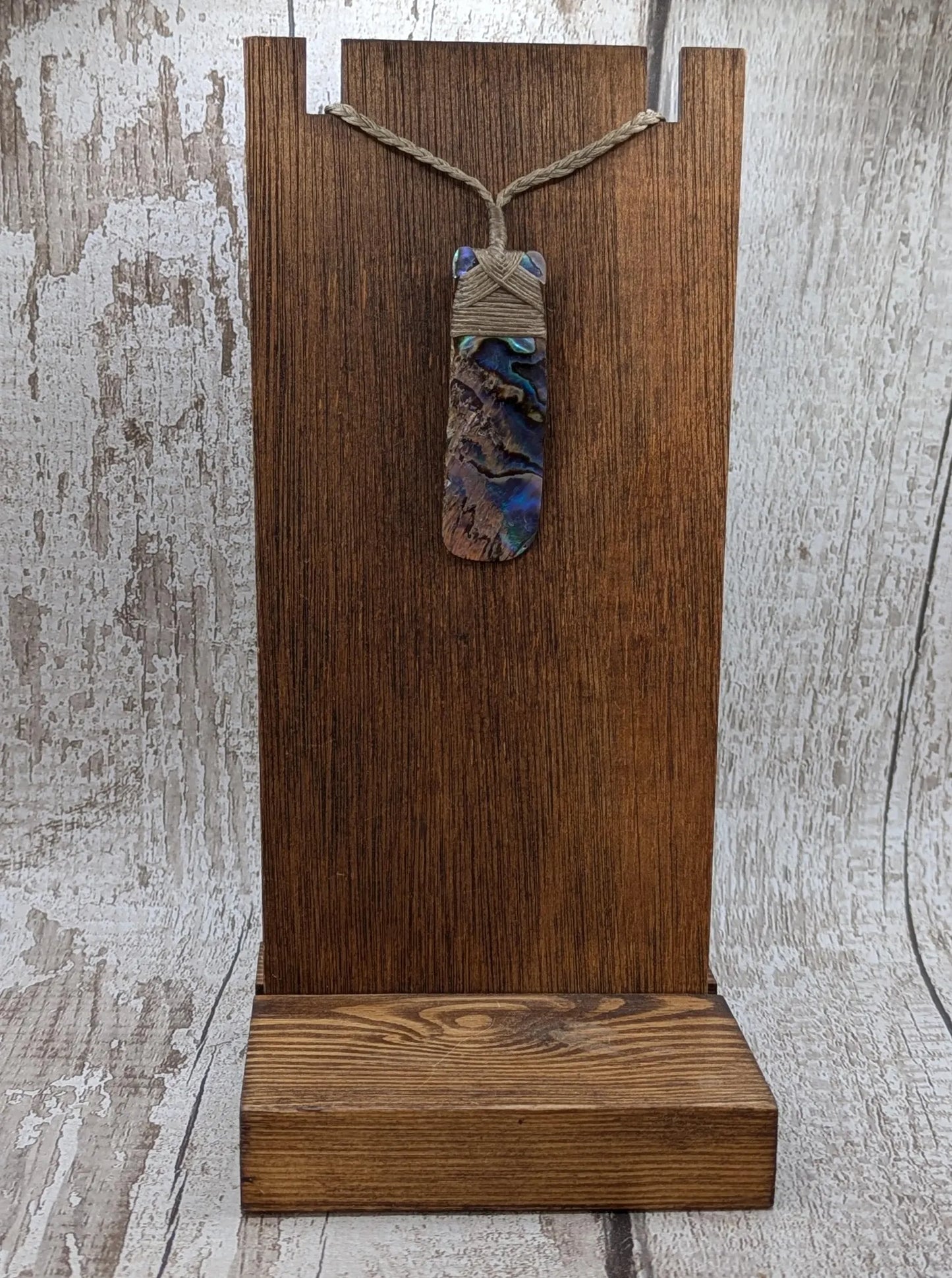 One New Zealand wild rainbow Pāua Hei Toki adze pendant.
