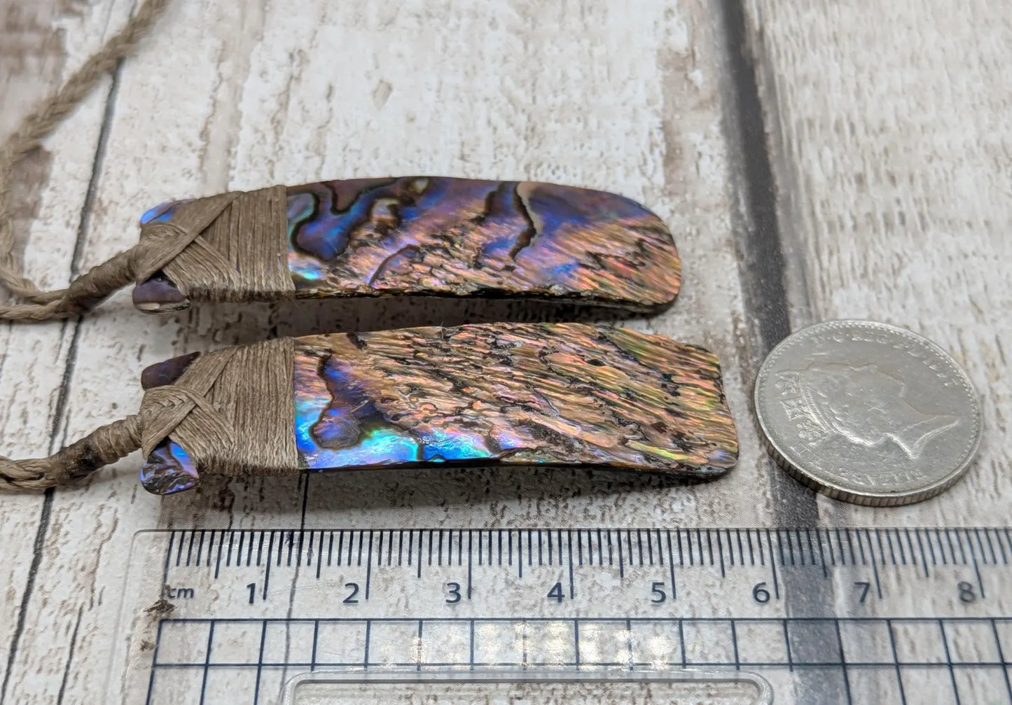 One New Zealand wild rainbow Pāua Hei Toki adze pendant.