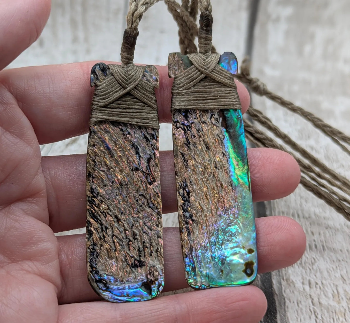 One New Zealand wild rainbow Pāua Hei Toki adze pendant.