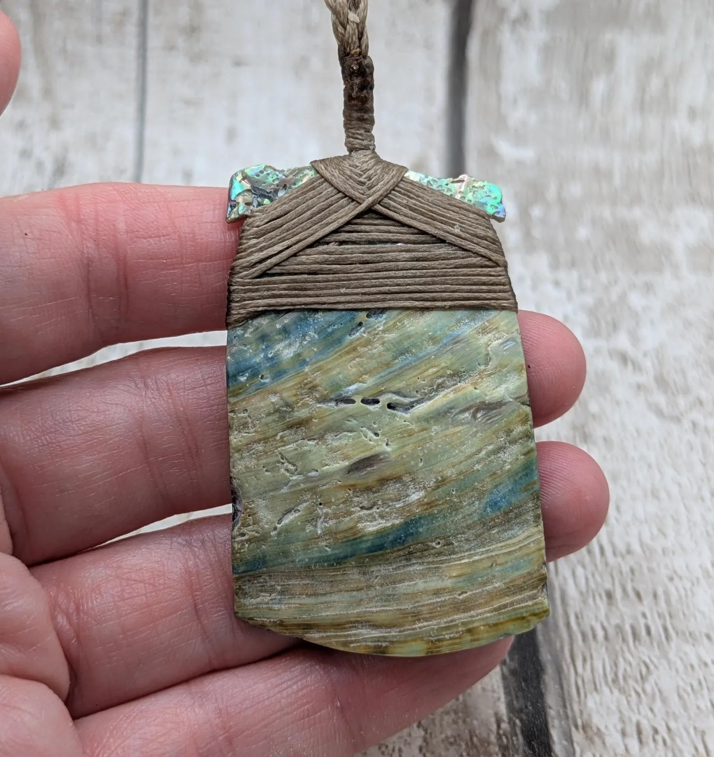 Wild New Zealand freshwater Pāua shell Hei Toki adze pendant